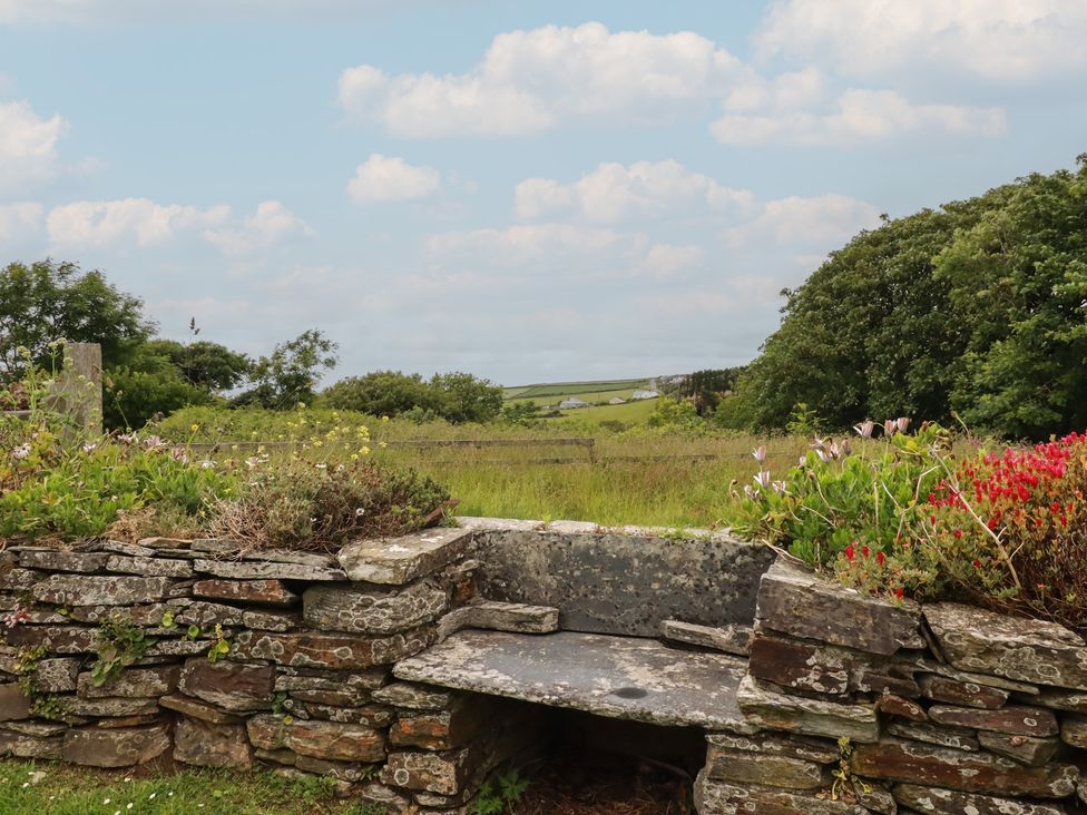 A stone bench in a garden at Atlantic View in Tintagel
