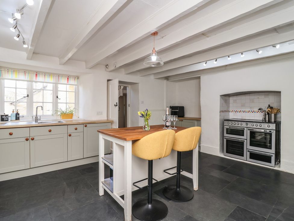 A kitchen with a sink and cabinets at Tregonhawke Farmhouse in Millbrook