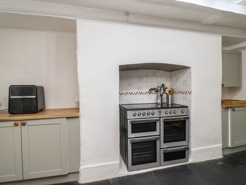 A kitchen with an oven and toaster at Tregonhawke Farmhouse in Millbrook