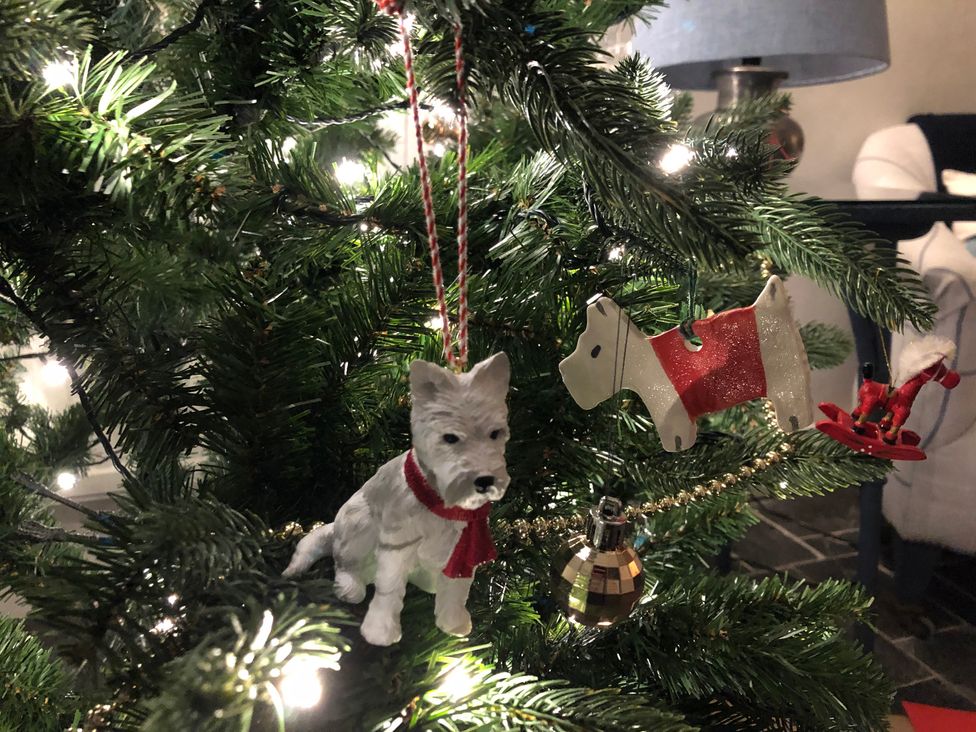 A Christmas tree with dog ornaments and decorations at Clamoak Cottage near Bere Alston