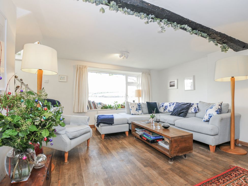 A living room with a sofa and coffee table at Clamoak Cottage Clamoak near Bere Alston