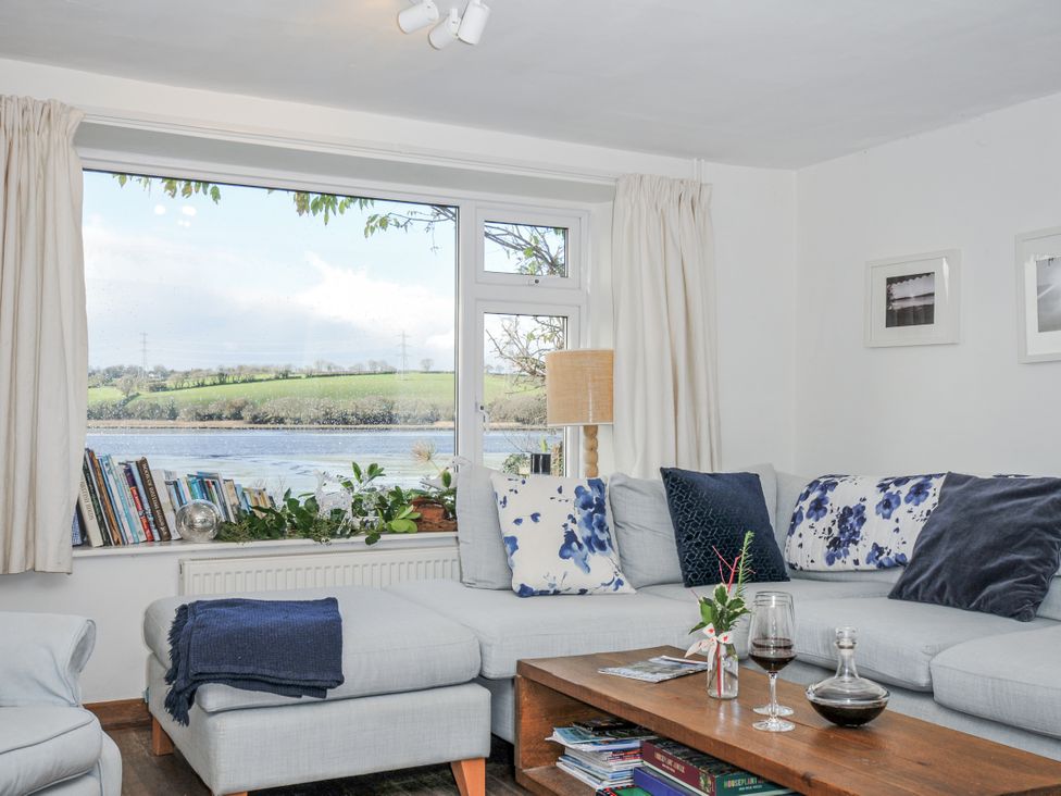 A living room with a sofa and coffee table at Clamoak Cottage Clamoak near Bere Alston