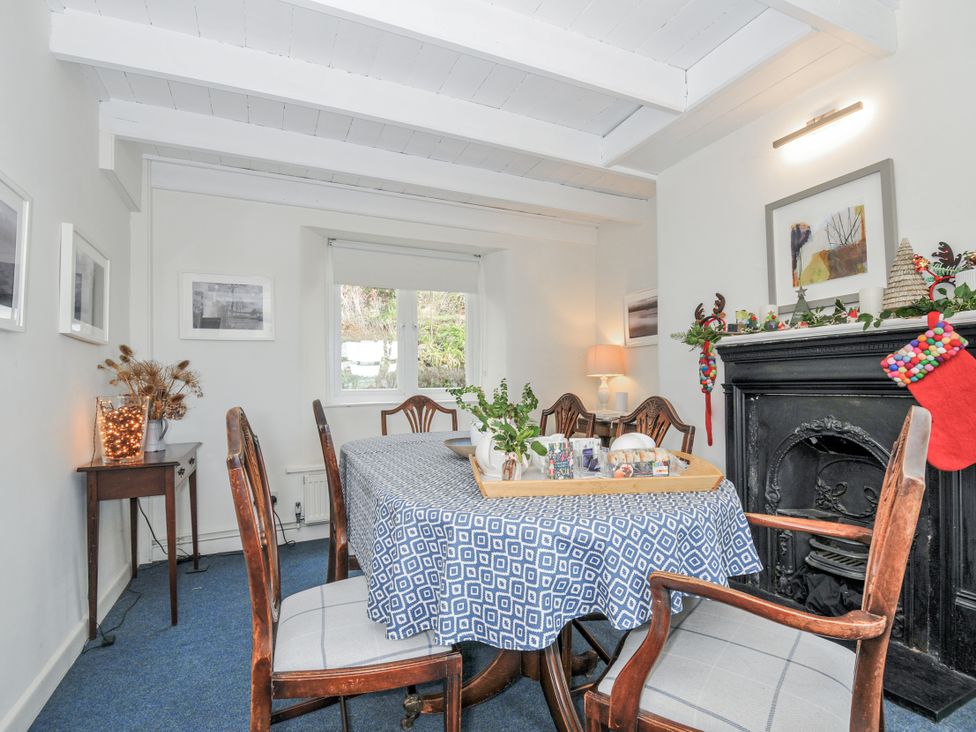 A dining room with a table and chairs at Clamoak Cottage Clamoak near Bere Alston