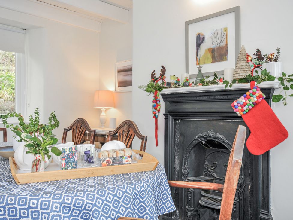 A dining room with a table and chairs at Clamoak Cottage Clamoak near Bere Alston