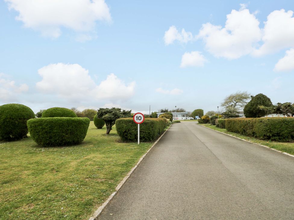 A road with bushes and a speed limit sign at 38 St Margarets in 
