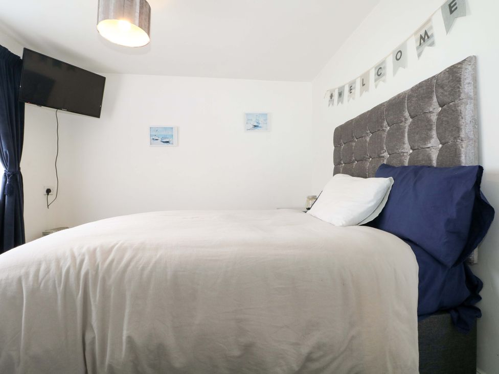 A bedroom with a bed and television at 38 St Margarets 