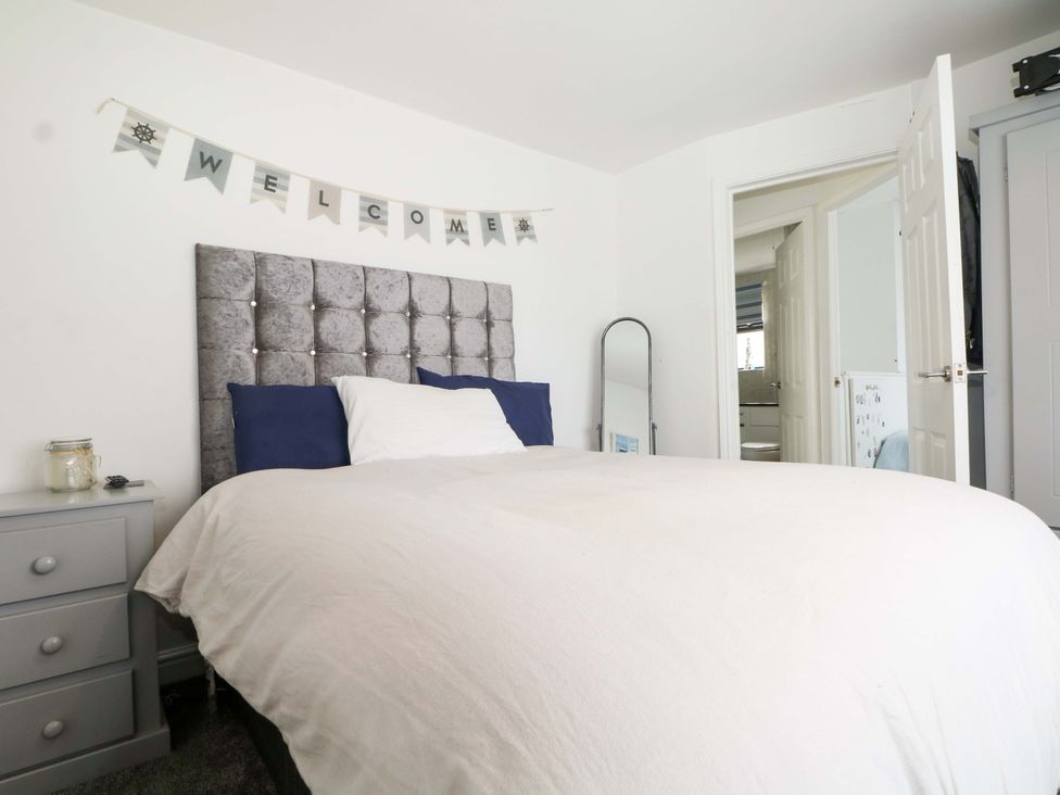 A bedroom with a bed and nightstand at 38 St Margarets