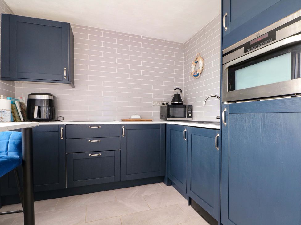 A kitchen with cabinets and appliances at 38 St Margarets