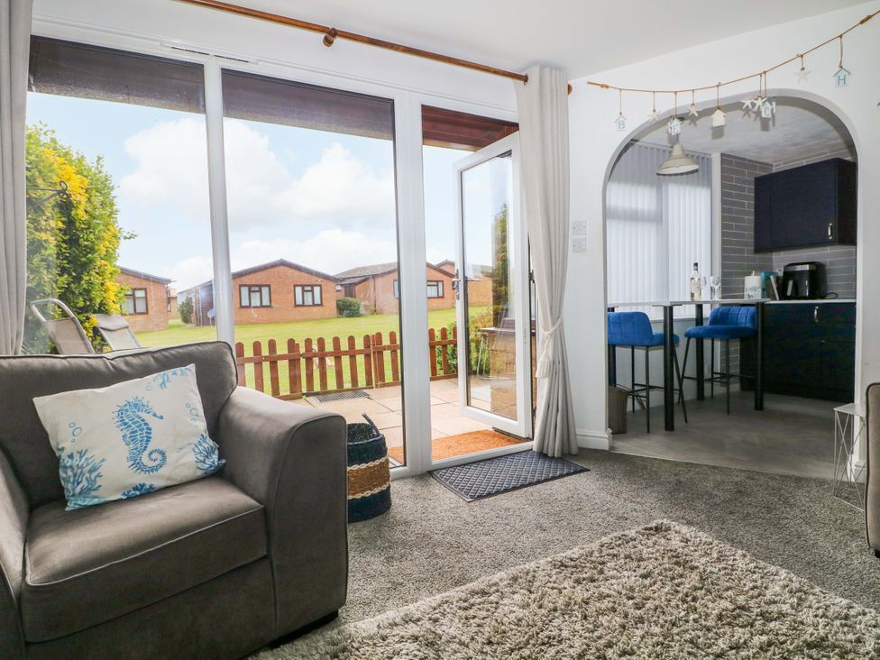 A living room with a view of the garden at 38 St Margarets