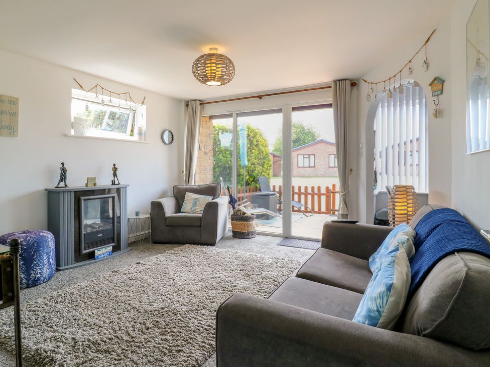 A living room with a sofa and fireplace at 38 St Margarets in St Margaret's At Cliffe