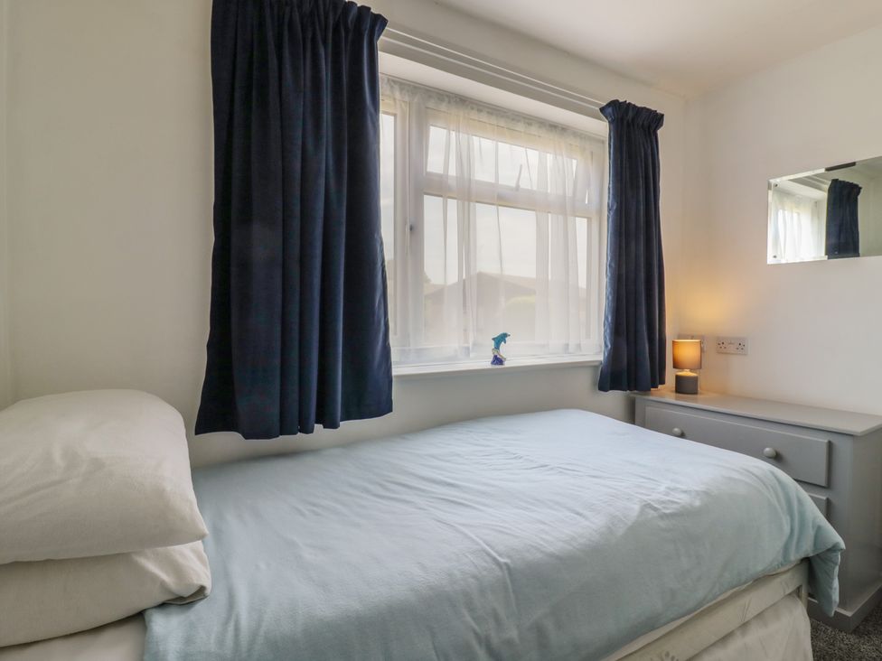 A bedroom with a bed and window at 38 St Margarets in St Margaret's At Cliffe