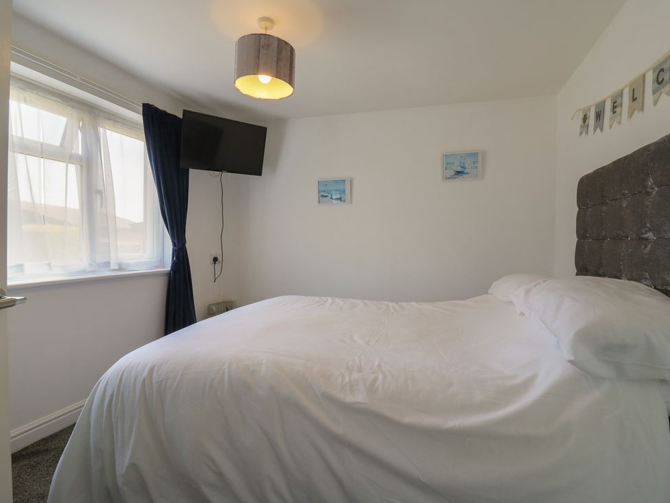 A bedroom with a bed and television at 38 St Margarets, St Margaret's At Cliffe
