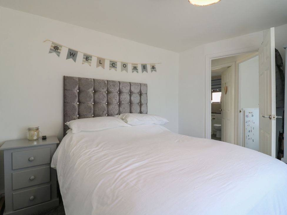 A bedroom with a bed and a welcome banner at 38 St Margarets, St Margaret's At Cliffe