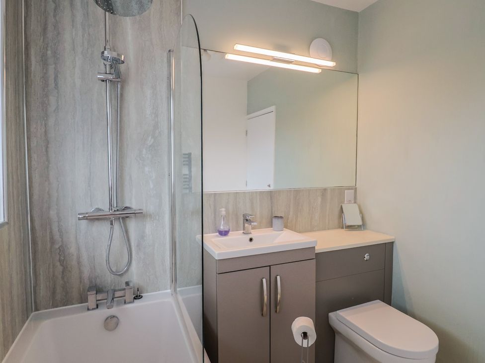 A bathroom with a shower and sink at Sunny Croft Broadmayne near Dorchester