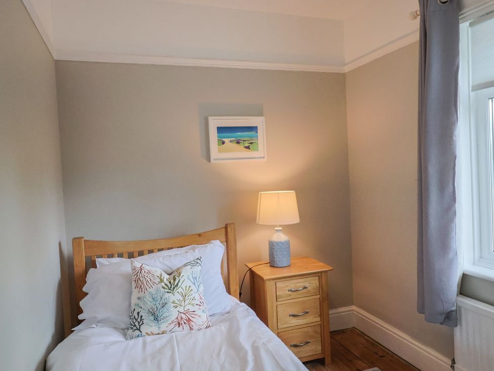 A bedroom with a bed and nightstand at Sunny Croft in Broadmayne near Dorchester