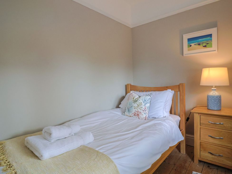 A bedroom with a bed and bedside table at Sunny Croft in Broadmayne near Dorchester