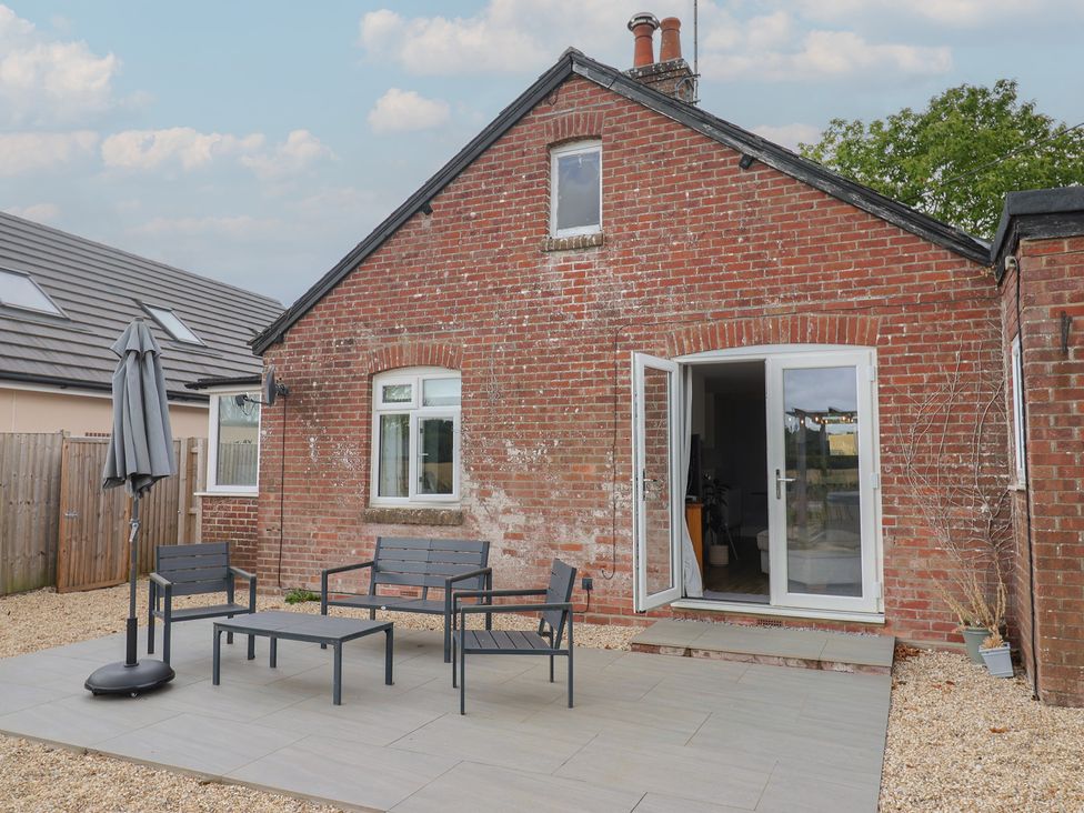 A garden with patio furniture at Sunny Croft in Broadmayne near Dorchester
