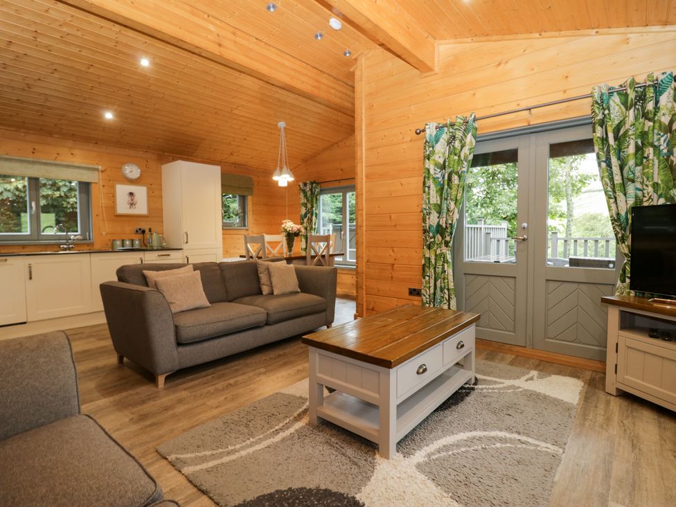 A living room with a sofa and coffee table at Oak Lodge Pennington near Ulverston