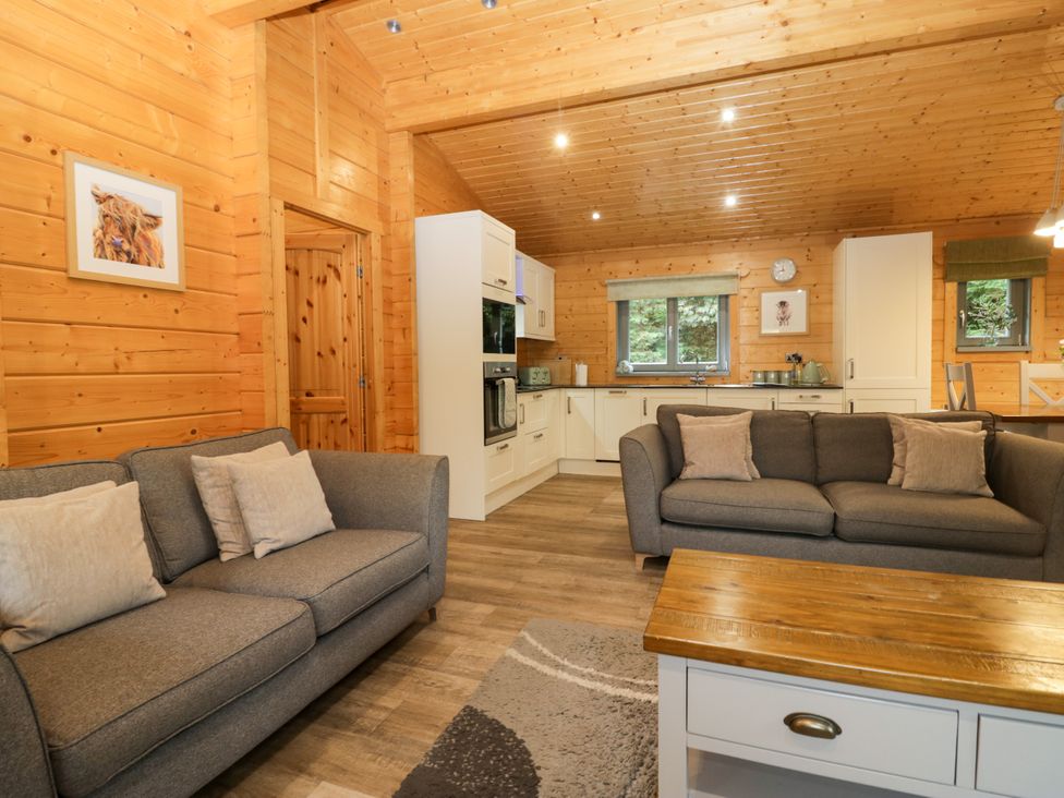 A living room with sofas and a coffee table at Oak Lodge Pennington near Ulverston