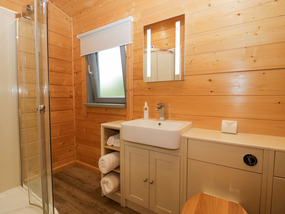 A bathroom with shower and sink at Oak Lodge in Pennington near Ulverston