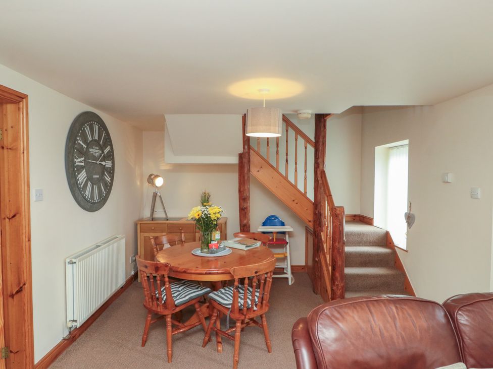 A dining room with a table and chairs at Milton Cottage in Hawsker near Whitby and Robin Hood's Bay