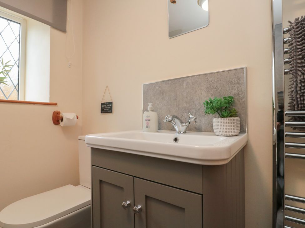 A bathroom with a sink and toilet at Milton Cottage in Hawsker near Whitby and Robin Hood's Bay