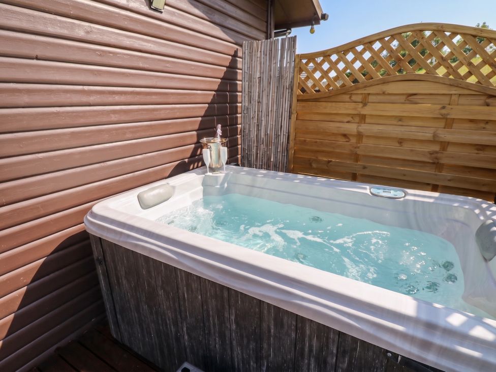 A hot tub in an outdoor area at 16 Badgers Retreat in Richmond