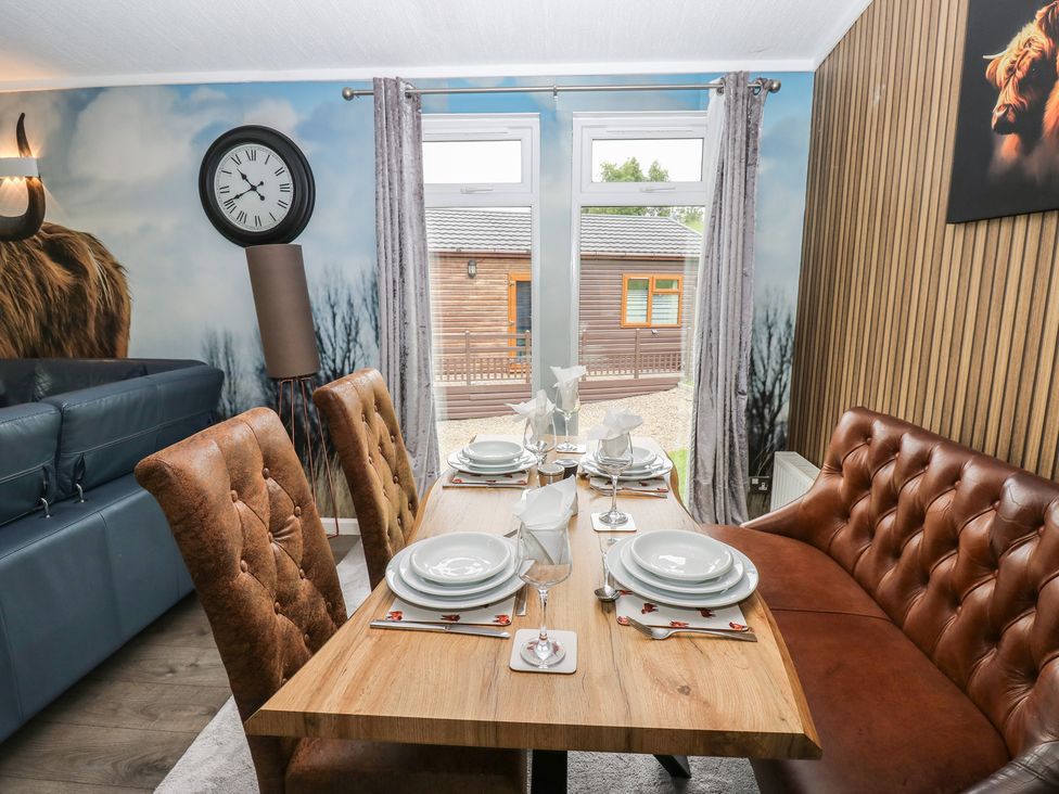 A dining room with a table set for dinner at 16 Badgers Retreat in Richmond