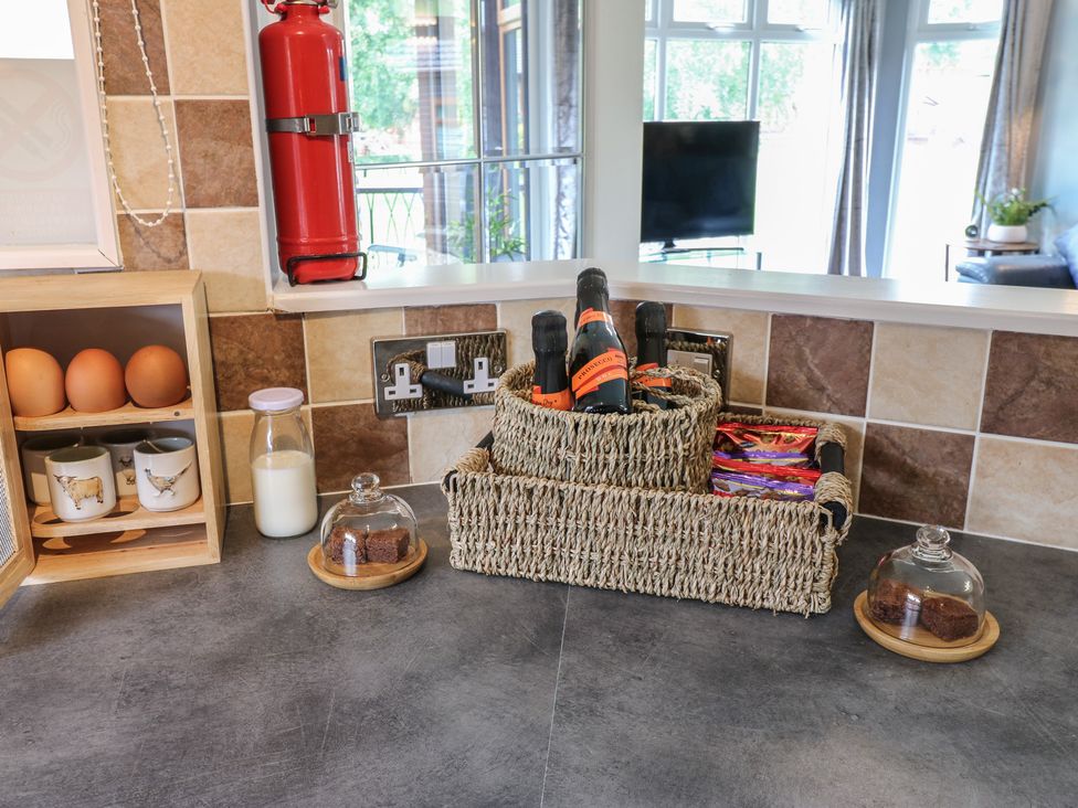 Kitchen countertop with eggs, milk, cups, and a fire extinguisher at 16 Badgers Retreat in Richmond