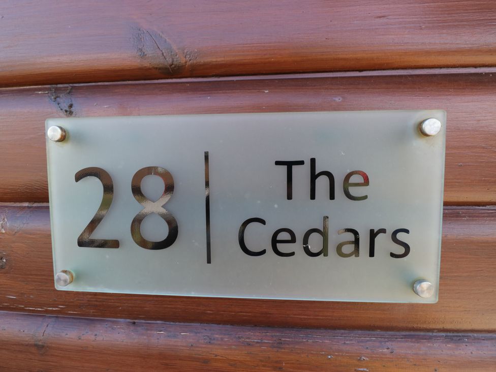 A name plate with the number 28 and The Cedars at The Cedars in South Lakeland Leisure Village