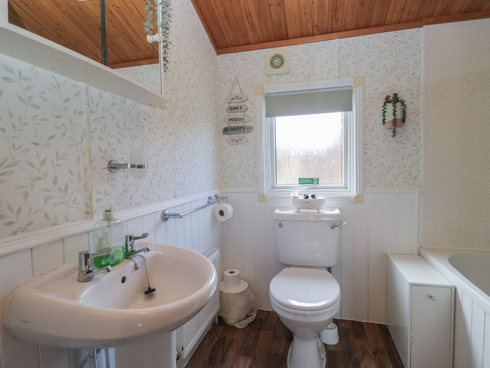 A bathroom with a sink and toilet at The Cedars in South Lakeland Leisure Village