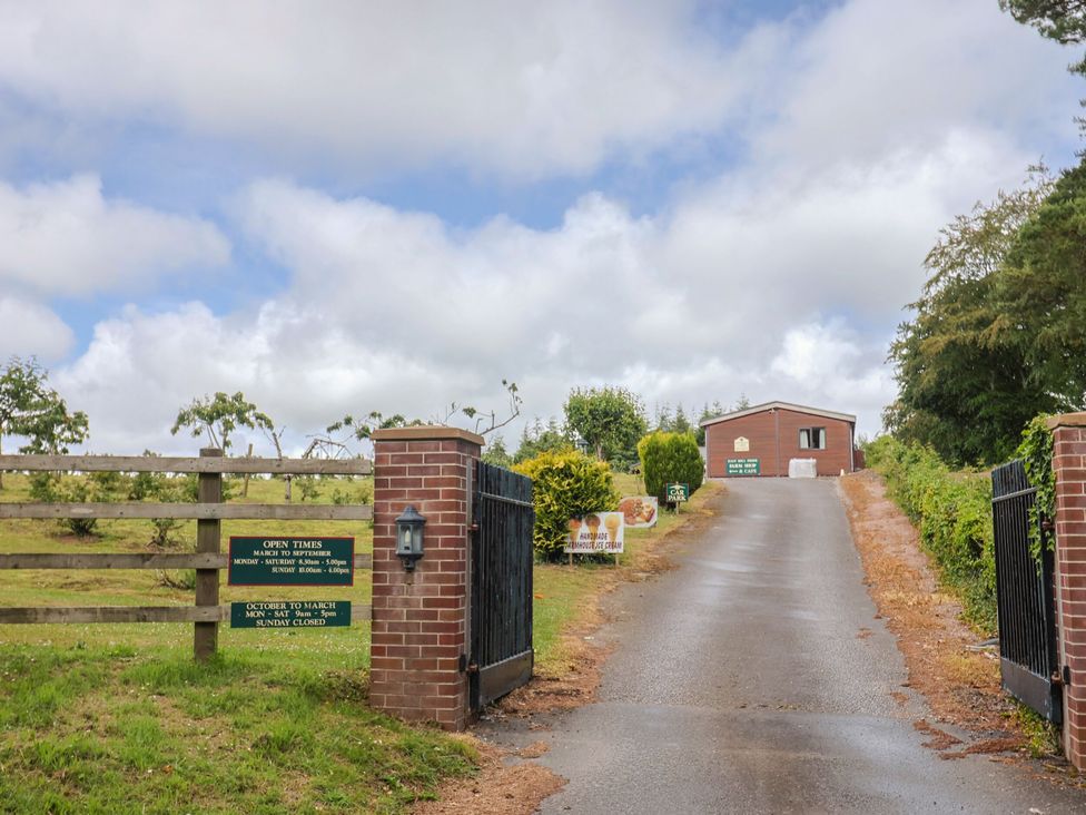 A gate and driveway leading to a building at The Cabin at East Hill Pride Four Elms Hill Nr. Sidmouth