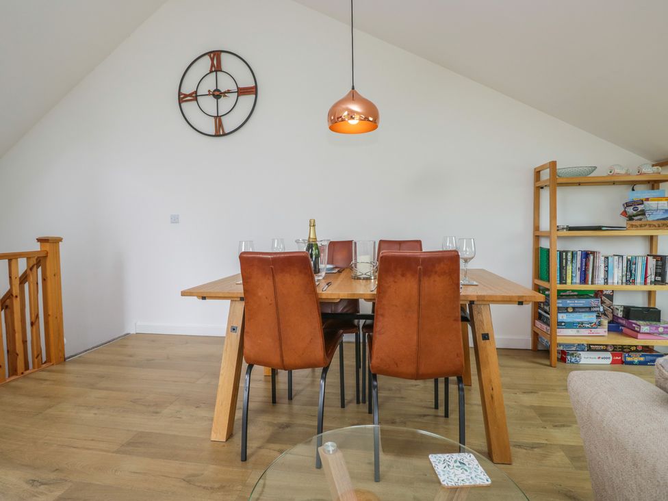A dining room with a table and chairs at Coney Garth Retreat in Beckermet