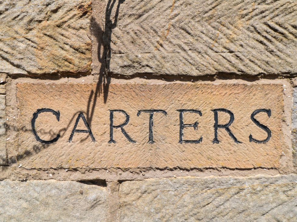 A stone wall with the name CARTERS in Staintondale near Burniston