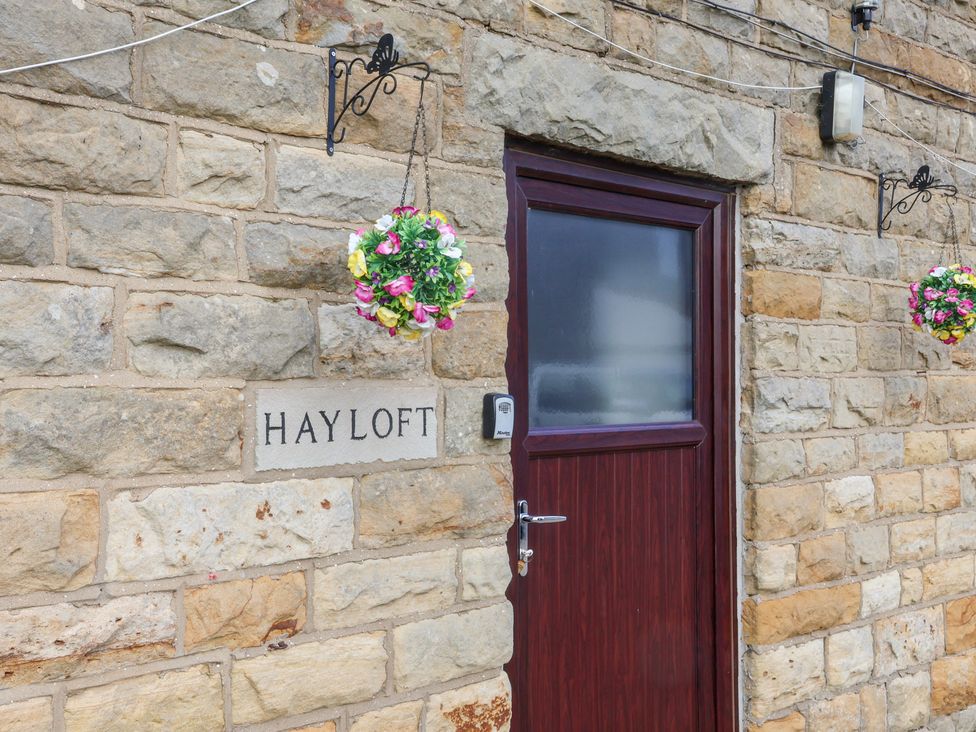 A door with a nameplate at the Hayloft in Staintondale