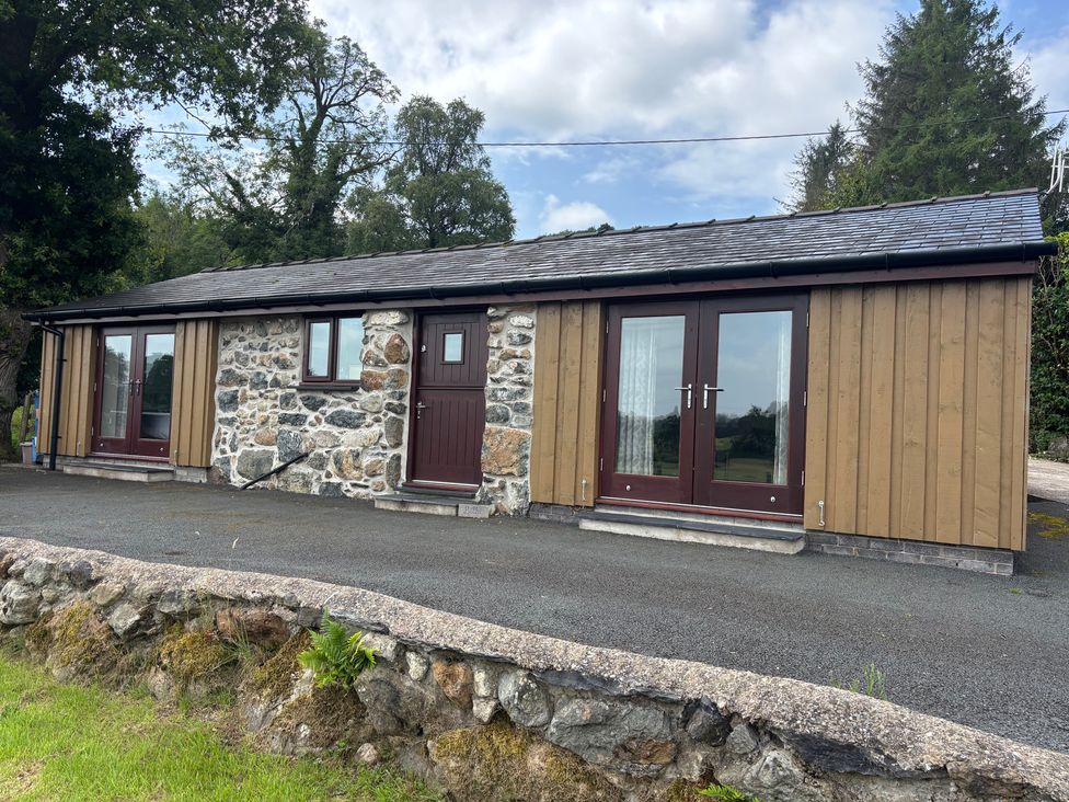 An exterior view of a building with stone and wood features at Bothi in Llanuwchllyn