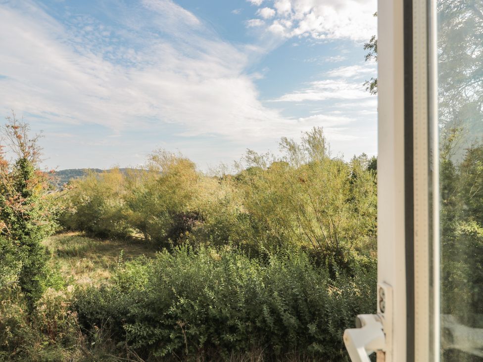 A view from a window showing greenery and sky at 1 Westcroft Cottage in King's Stanley