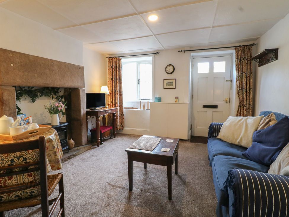 A living room with a sofa and coffee table at The Hill in Cromford