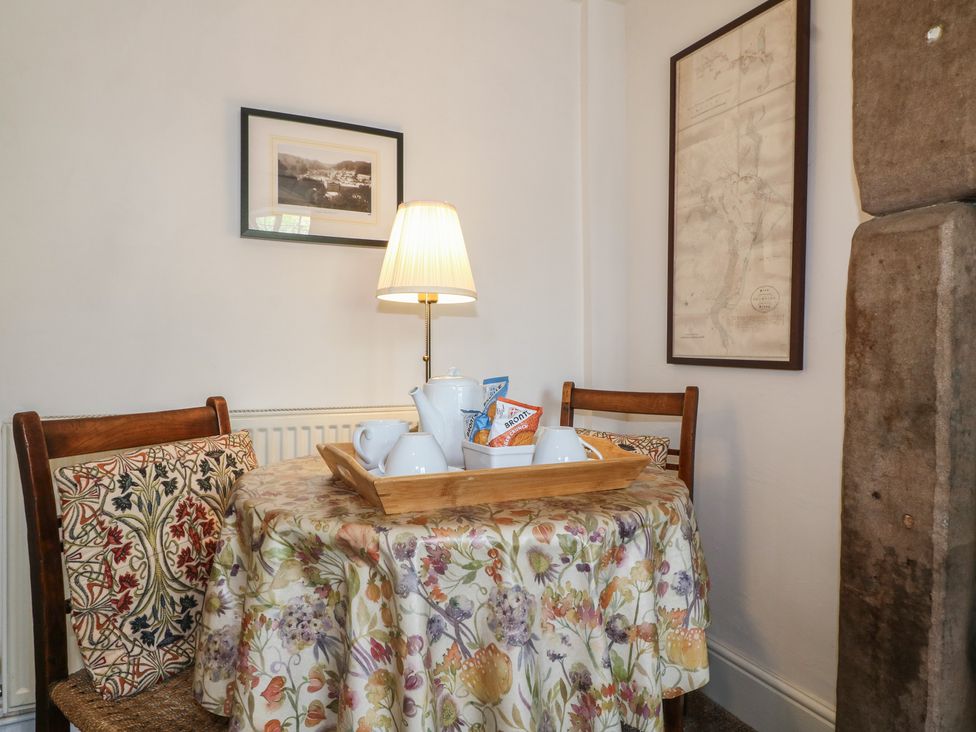 A dining room with a table set for tea at The Hill in Cromford