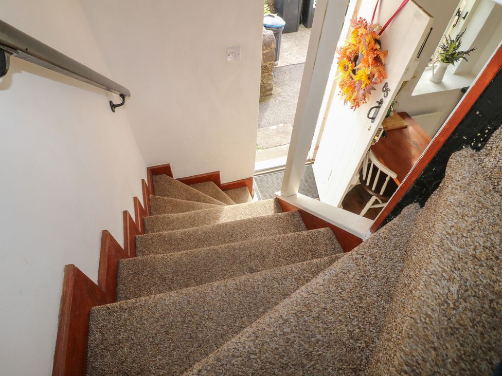 A staircase leading to a front door at The Hill in Cromford