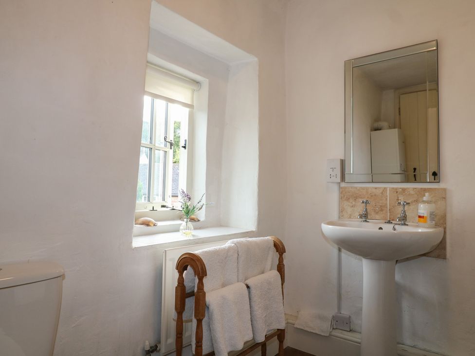 A bathroom with a sink and toilet at The Hill in Cromford