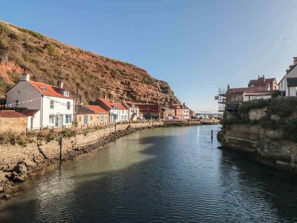 A river with houses along the banks at Bramla in Staithes