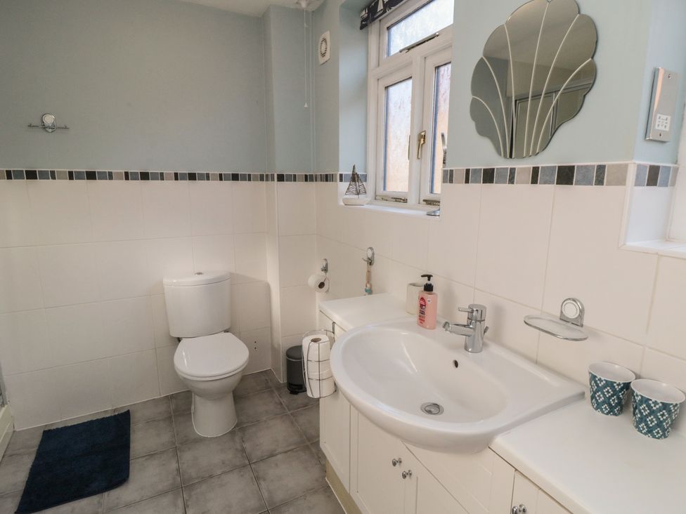A bathroom with a sink and toilet at Bramla in Staithes