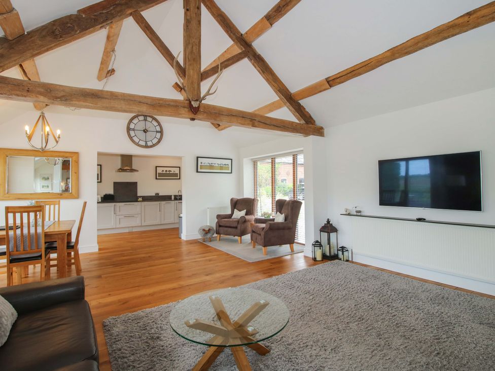 A living room with a dining area and kitchen in Meeson View near Waters Upton