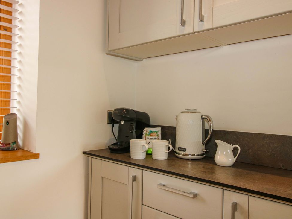 A kitchen with a kettle and coffee machine at Meeson View in Meeson near Waters Upton