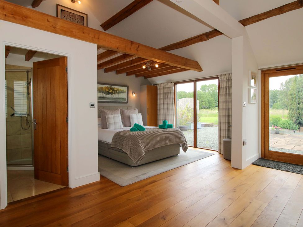 A bedroom with a bed and shower at Meeson View near Waters Upton