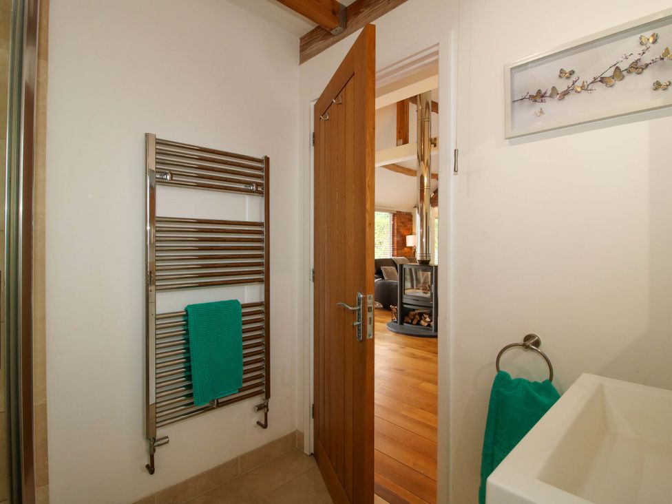 A bathroom with a towel rail and wash basin at Meeson View near Waters Upton