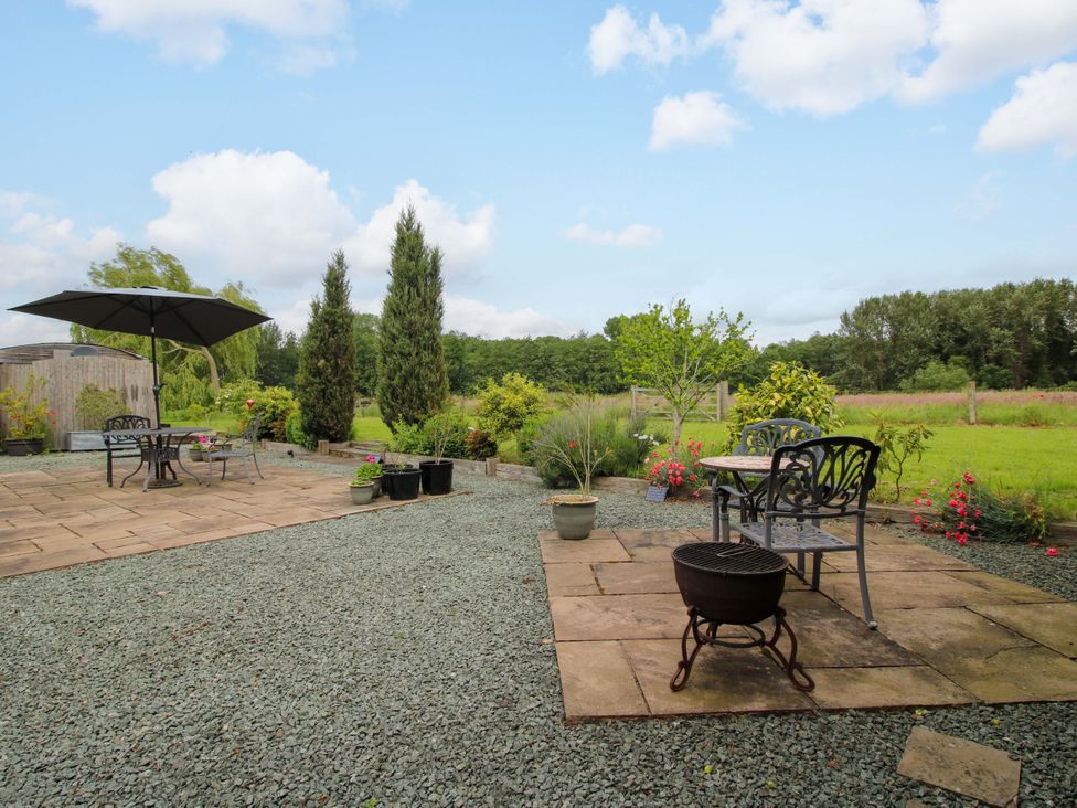 A garden with seating area and plants at Meeson View in Meeson near Waters Upton