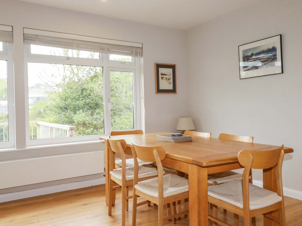A dining room with a table and chairs at The Meadow in Feock near Carnon Downs