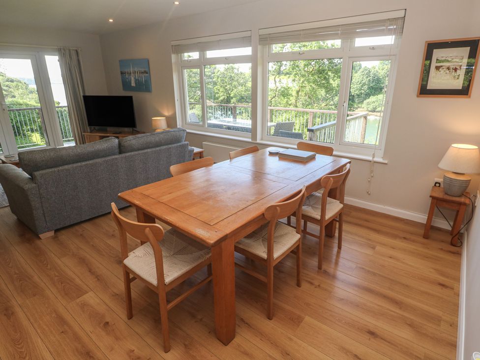 A dining room with a table and chairs at The Meadow in Feock near Carnon Downs